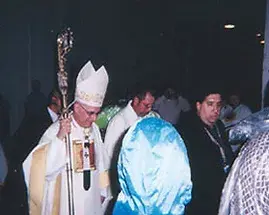 AESS security escorting a bishop in a religious procession
